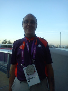 Korky wearing a Siver medal at the Olympic Stadium